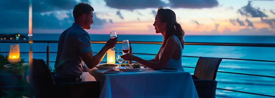 Couple dining ocean sunset